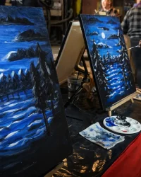 Guests painting nighttime landscape canvases during Paint Night at Factory of Terror in Fall River MA