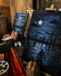 Guests painting nighttime scenes together during Paint Night at Factory of Terror in Fall River MA